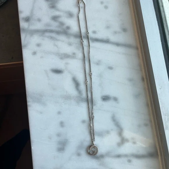 Interlocking gucci necklace .